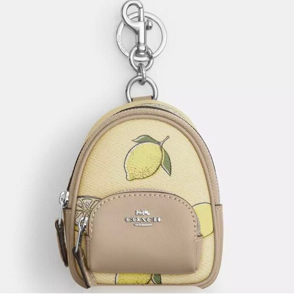 Coach Handbags - COACH COURT BACKPACK CHARM LEMON 🍋 PRINT